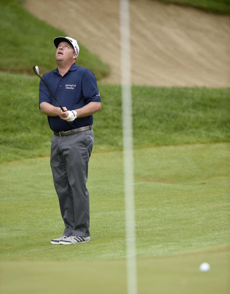 Carl Pettersson mid-swing on green golf course with sand bunker focused golf action wallpaper