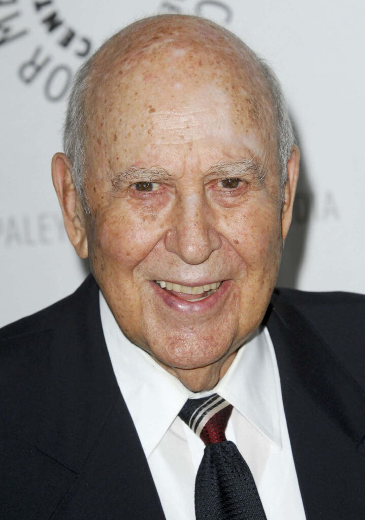 Carl Reiner smiling in dark suit and striped tie high resolution portrait wallpaper background