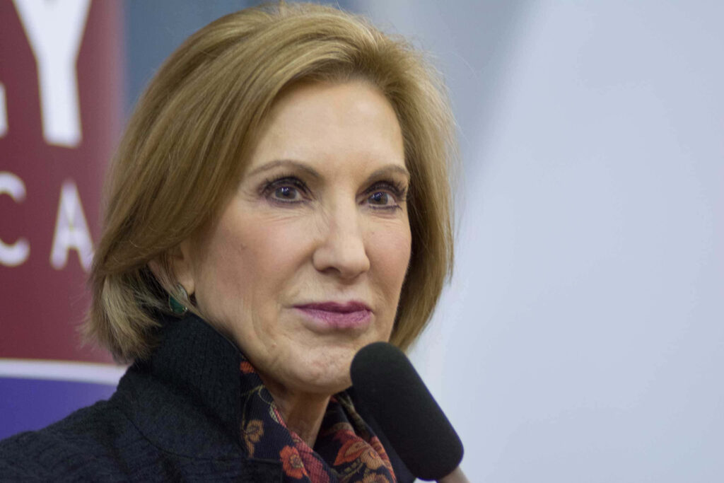 Carly Fiorina portrait with pursed lips soft lighting professional attire neutral background wallpaper