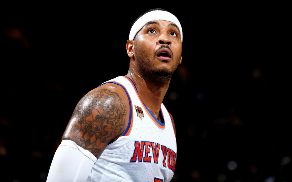 Carmelo Anthony intense portrait New York Knicks jersey vivid lighting tattooed arm dark background Wallpaper