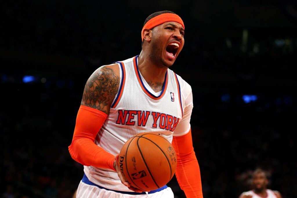 Carmelo Anthony shouting on court in New York Knicks uniform dynamic basketball action wallpaper