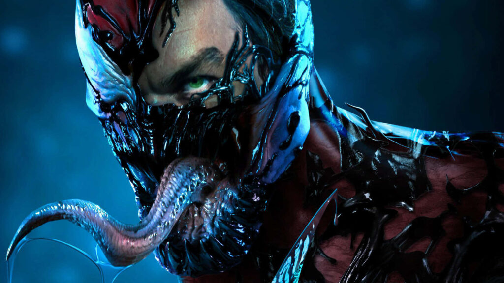 Close-up of Carnage with sharp teeth glowing green eyes and venomous tongue on dark blue background Wallpaper