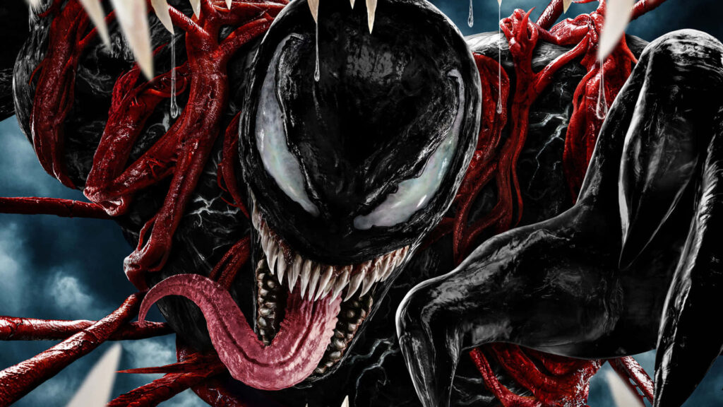 Carnage Unleashed wallpaper showing symbiote menace with sharp teeth red tendrils stormy background