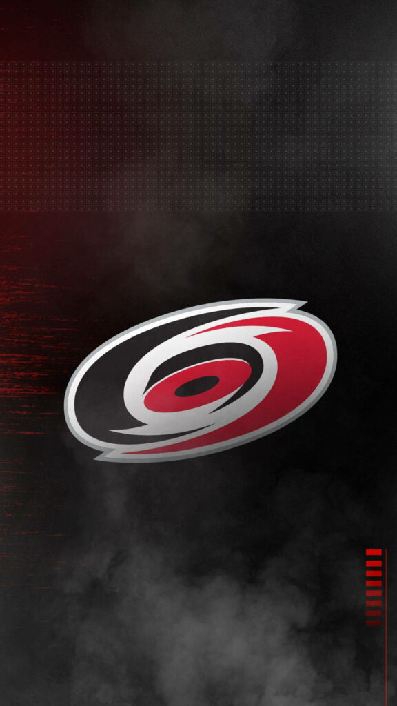 Carolina Hurricanes logo wallpaper in red white and black on dark smoky background hockey fans