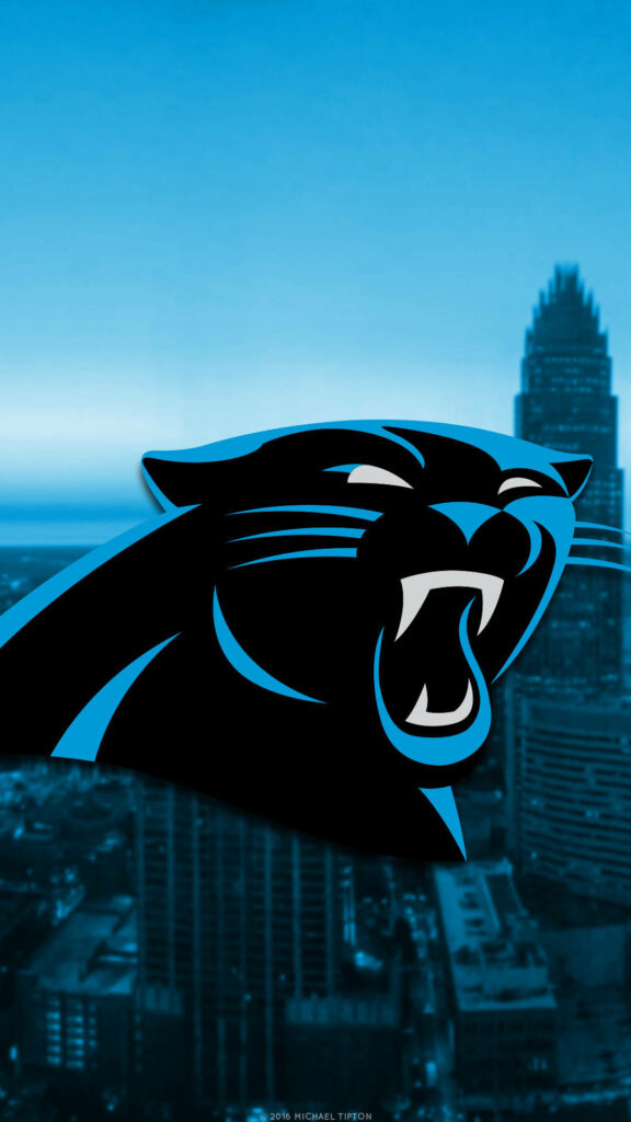 Carolina Panthers logo in black and blue with modern city skyline in cool blue sports wallpaper