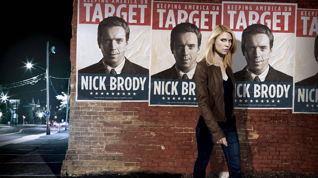 Carrie Mathison walking past Nick Brody campaign posters dark moody Homeland thriller wallpaper