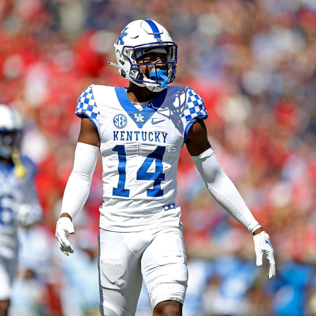 Carrington Valentine Kentucky Football number 14 in white blue uniform mid-game dynamic pose Wallpaper