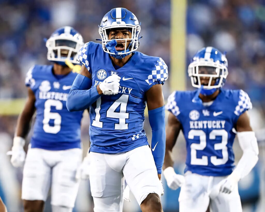 Carrington Valentine Kentucky Football number 14 intense action in blue white uniform stadium background Wallpaper