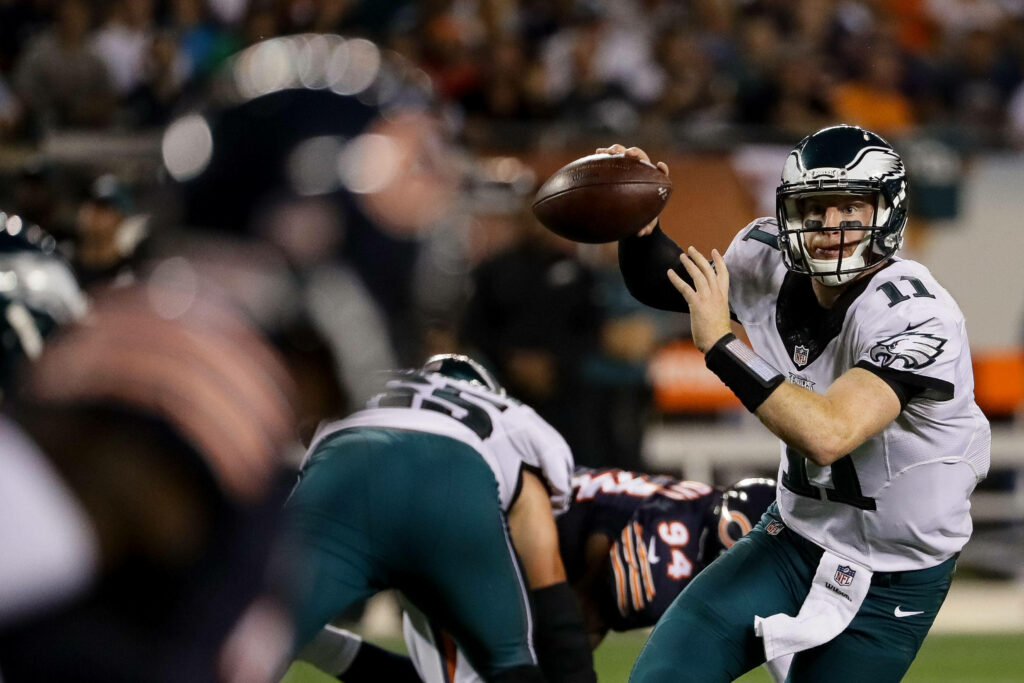 Dynamic Carson Wentz Wallpaper: Intense Game Action & Skillful Throw