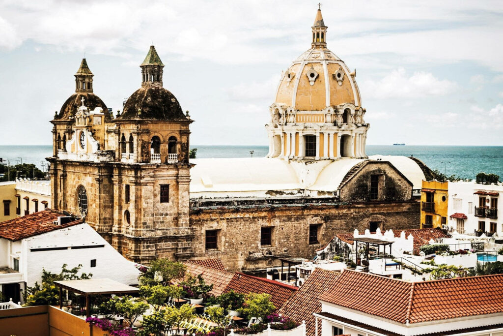 Top view of Cartagena Catholic Church historic architecture with Caribbean Sea and city rooftops Wallpaper