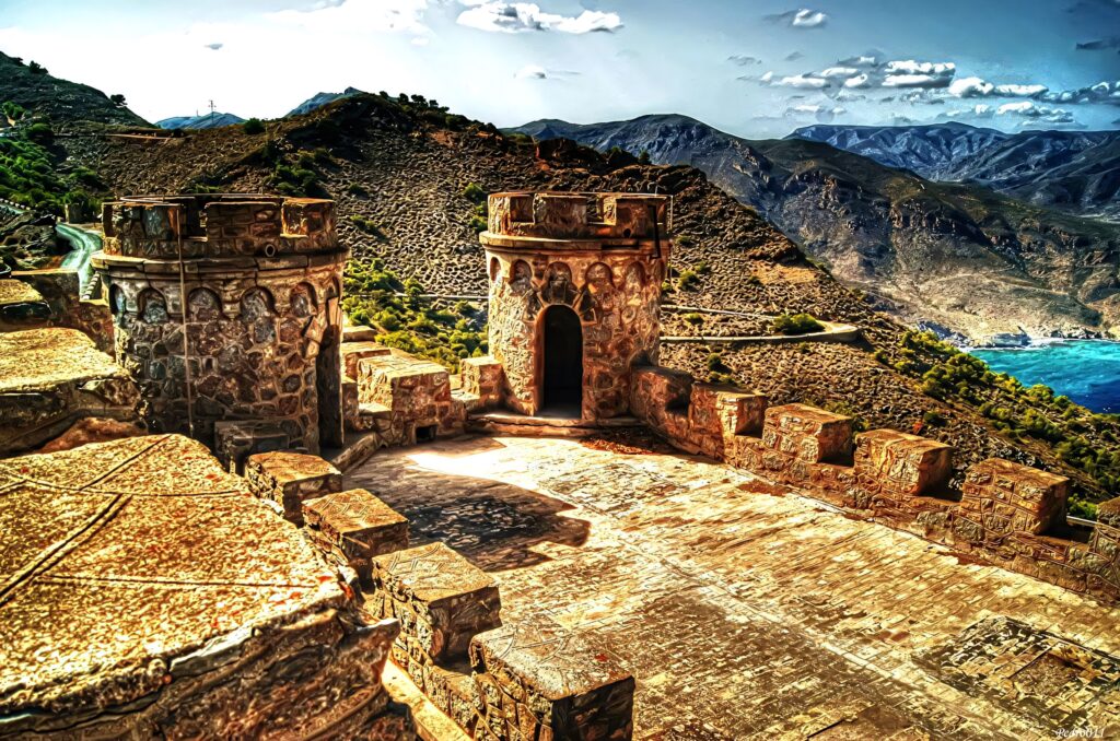 Panoramic view from Cartagena Fort of Colombia rugged hills and blue coastline under vivid sky Wallpaper