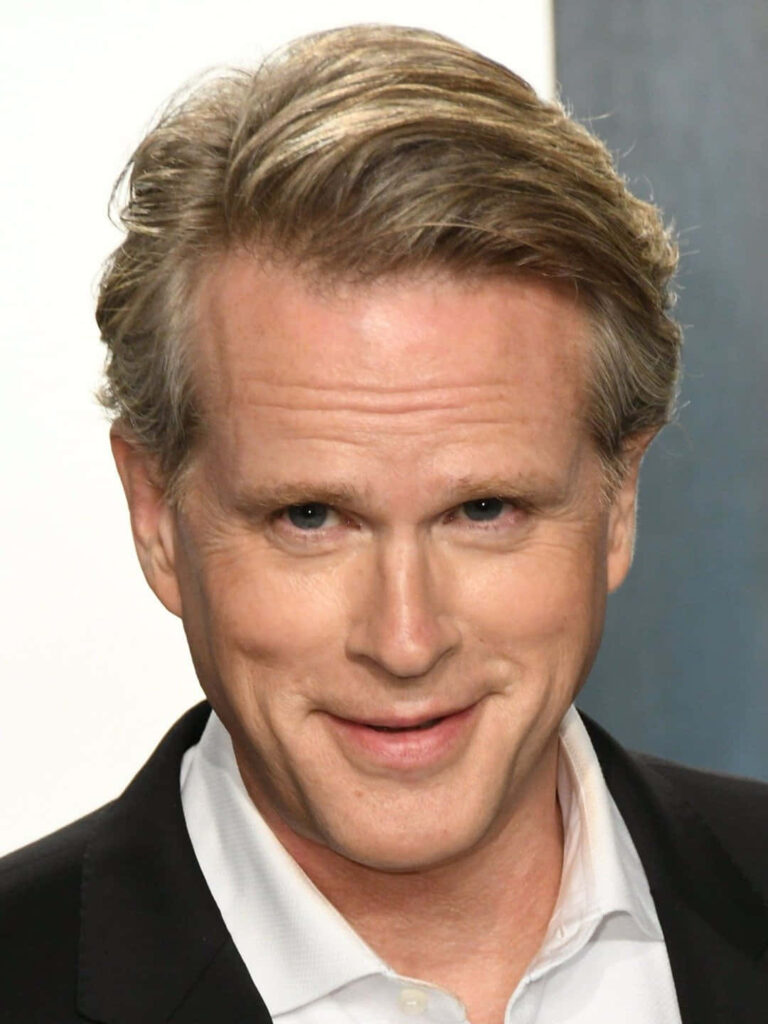 Cary Elwes close-up portrait in black suit and white shirt with charismatic confident style wallpaper