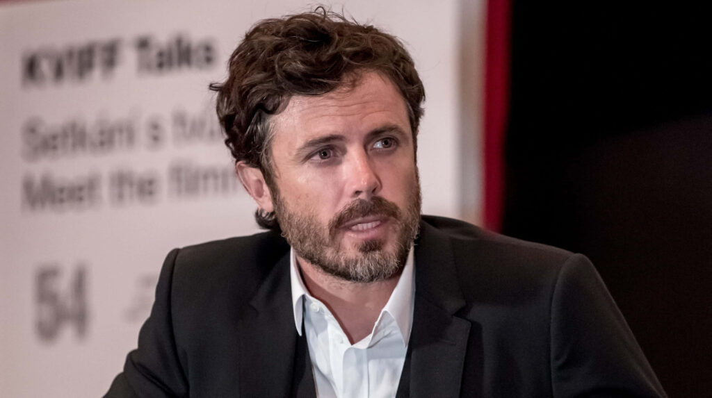 Casey Affleck portrait wallpaper with thoughtful gaze textured hair natural color palette detailed