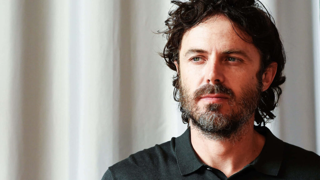 Casey Affleck portrait with rugged style natural light soft white curtain calm introspective mood Wallpaper