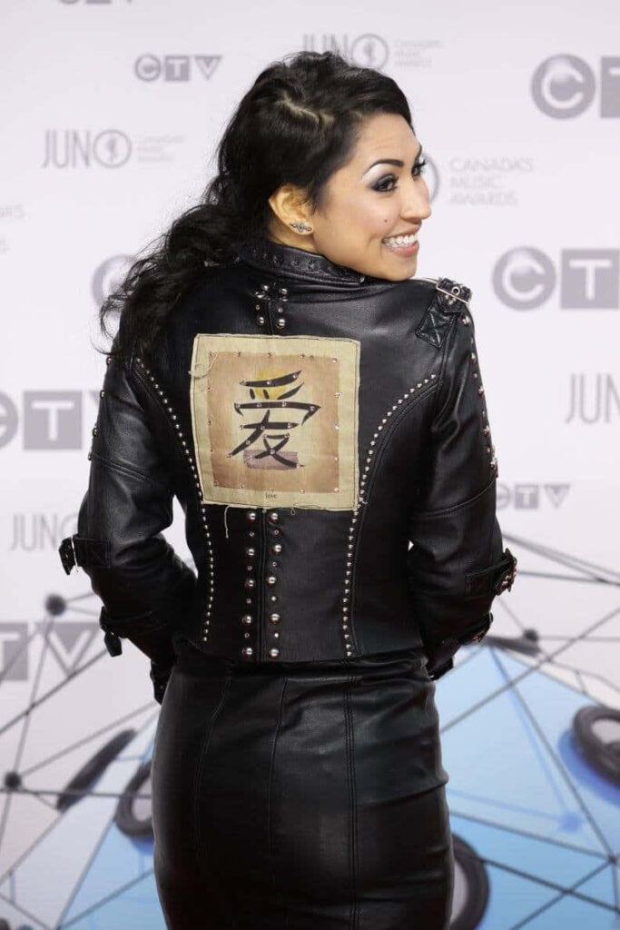 Cassie Steele edgy Juno Awards pose black leather jacket metallic studs Japanese kanji patch Wallpaper