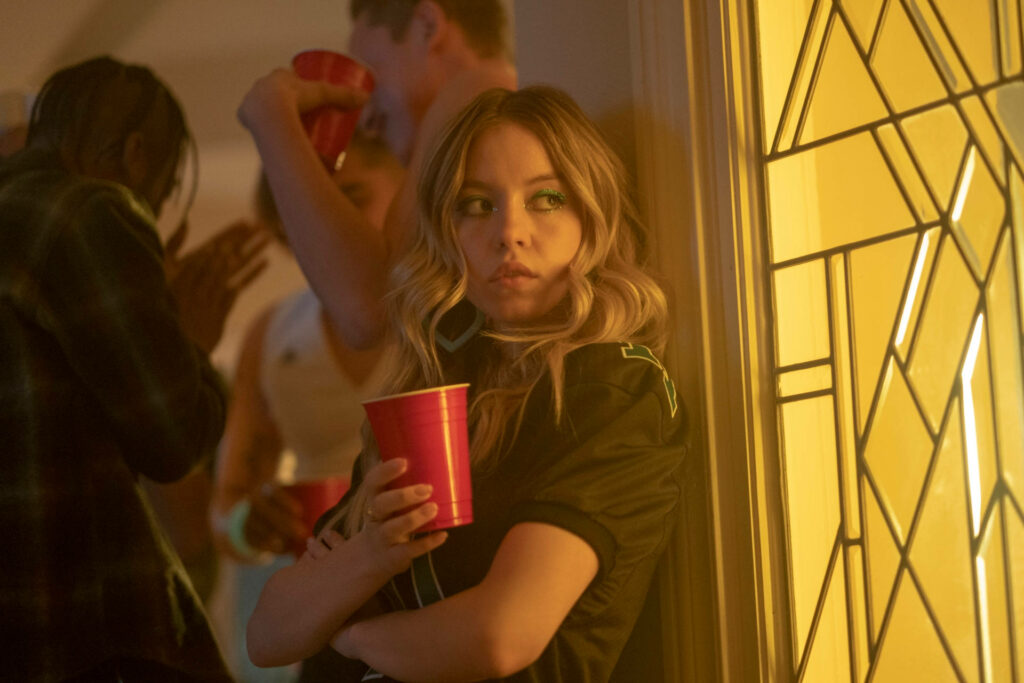 Cassie at Party: Euphoria Wallpaper Background with Warm Light