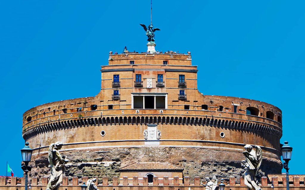 Castel Sant Angelo under bright blue sky with detailed stonework and angel statue HD wallpaper