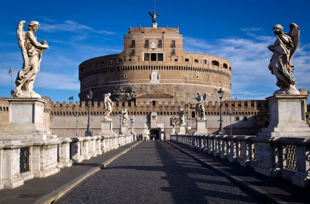 Castel Sant Angelo in Rome with angel statues bridge under vibrant blue sky wallpaper background