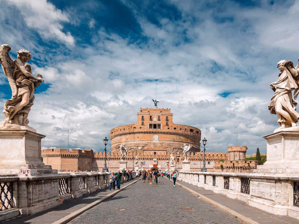 Castel Sant Angelo Rome with marble statues on bridge under dramatic colorful sky wallpaper background
