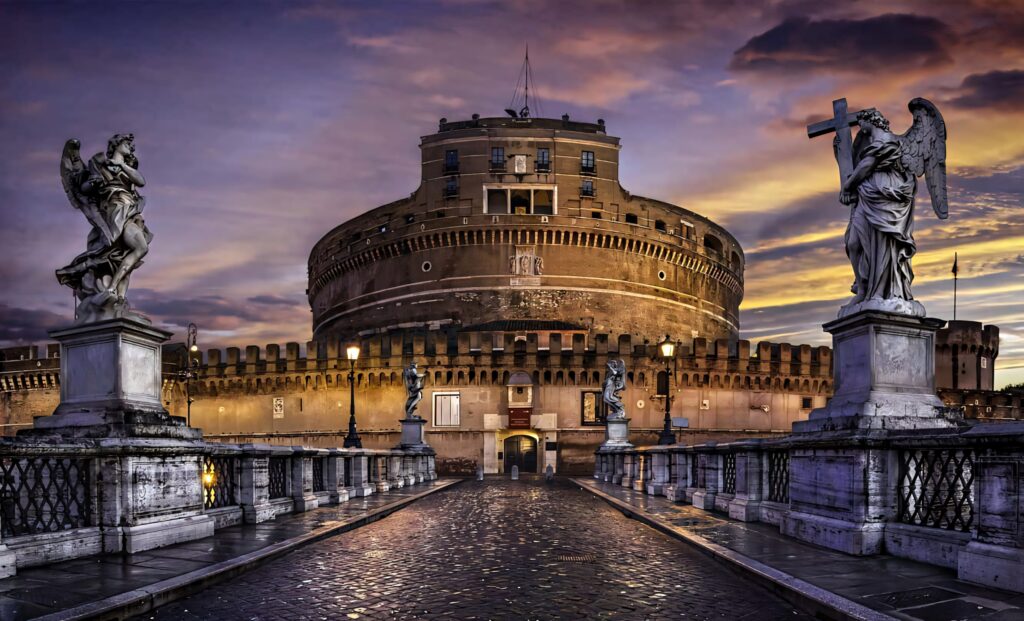 Castel Sant'Angelo at sunset with angel statues on bridge under golden dramatic clouds wallpaper