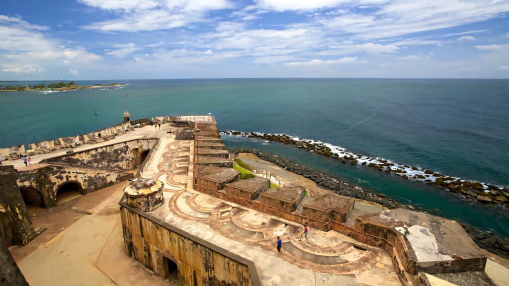 Castillo San Felipe del Morro fortress by blue ocean under bright sky historic Puerto Rico view wallpaper