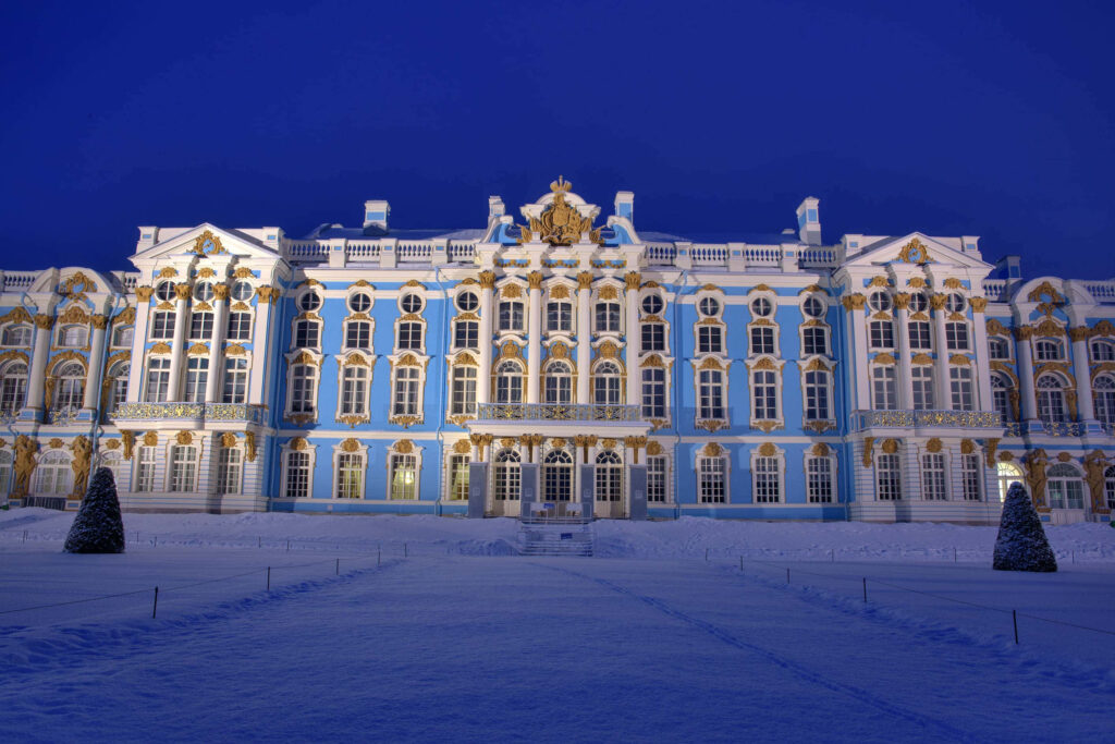 Catherine Palace at night with gold Baroque details snow-covered grounds winter wallpaper background