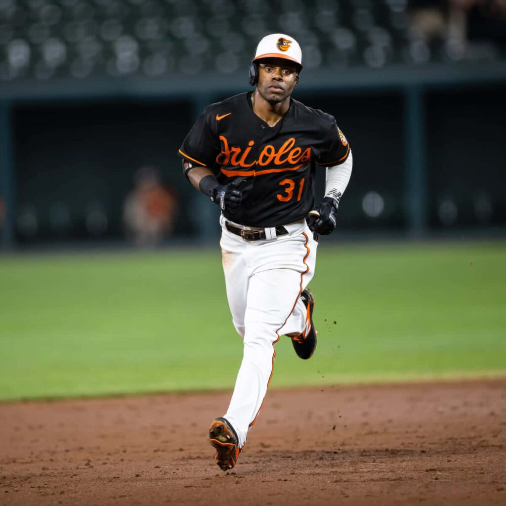 Cedric Mullins Baltimore Orioles dynamic action shot vibrant wallpaper showcasing athleticism