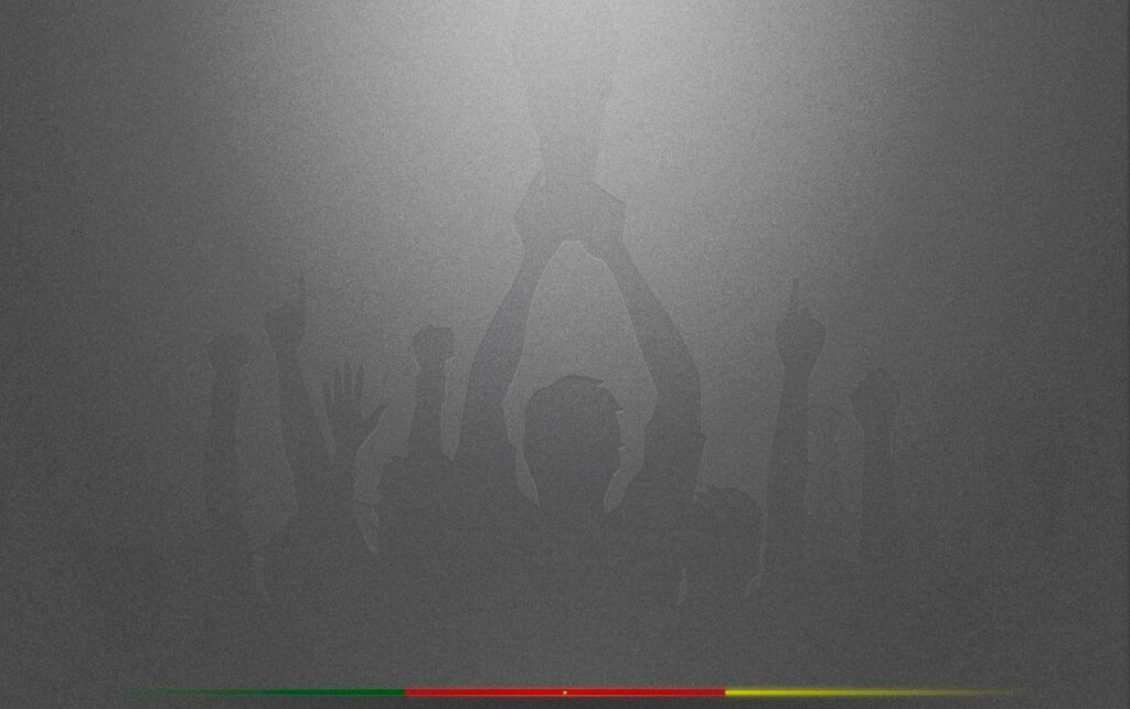 Celebrating Victory: Football Silhouettes with Cameroon Flag Inspiration Wallpaper