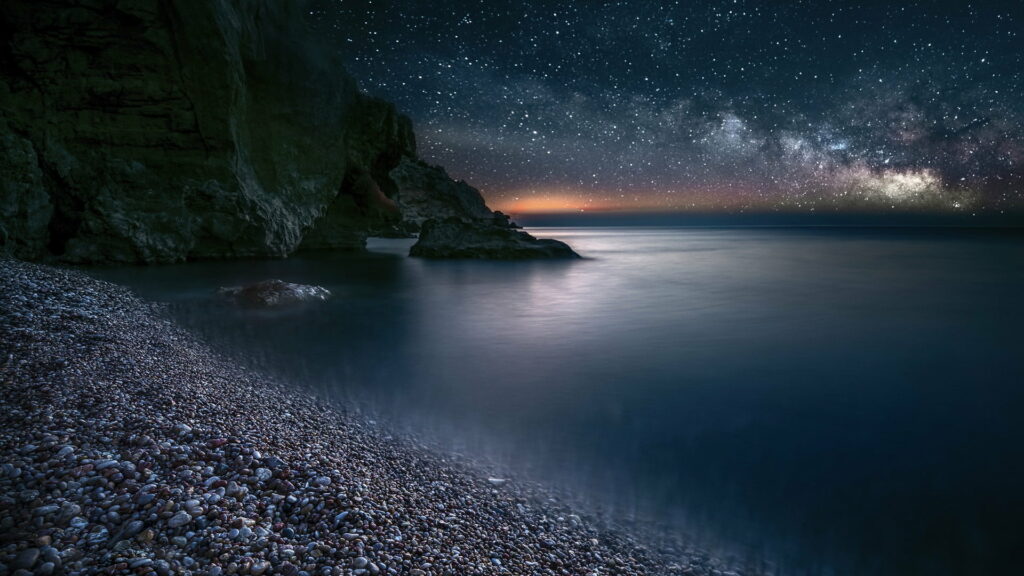Nighttime Nature's Celestial Symphony: Captivating Coastal Milkyway Over Ocean - HD Sea Background Wallpaper
