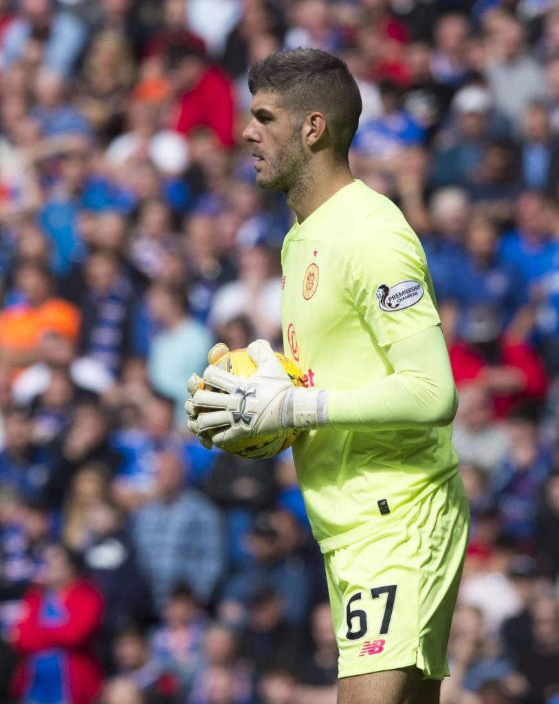 Celtic FC goalkeeper in neon yellow kit number 67 holding soccer ball side profile wallpaper