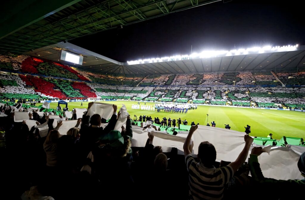 Celtic FC stadium vibrant green and white mosaic fans united under bright lights wallpaper background