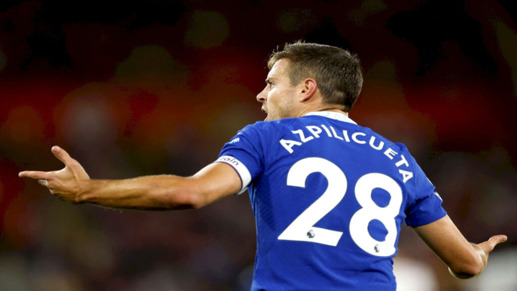 César Azpilicueta in blue jersey number 28 showing leadership and determination in football match Wallpaper