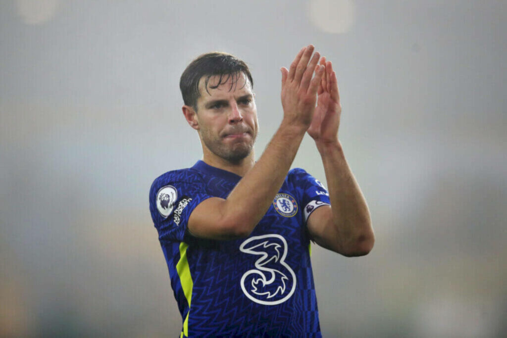 Chelsea's César Azpilicueta clapping in blue home kit with blurred background wallpaper