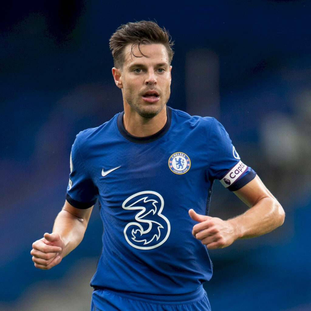 César Azpilicueta running in Chelsea blue jersey with captain armband intense action shot wallpaper