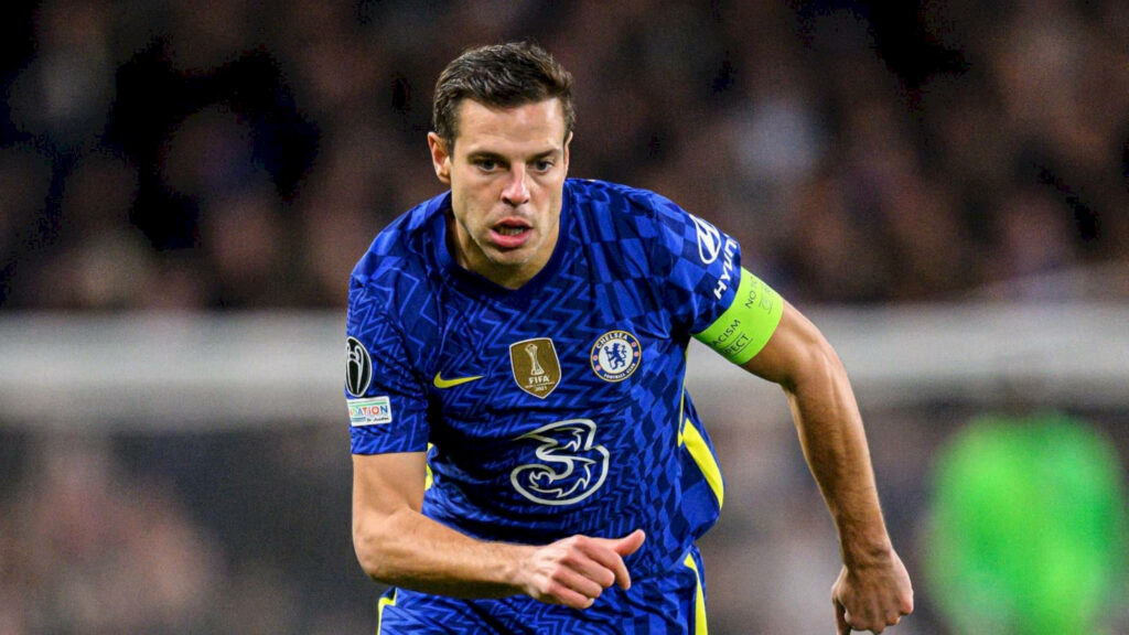 César Azpilicueta sprinting in Chelsea blue kit with captain armband dynamic football wallpaper