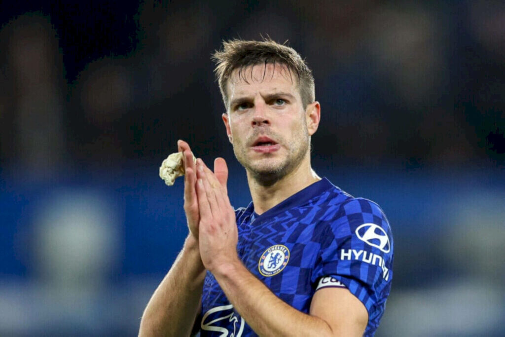 César Azpilicueta in Chelsea FC kit showing focus and leadership with blurred stadium background Wallpaper