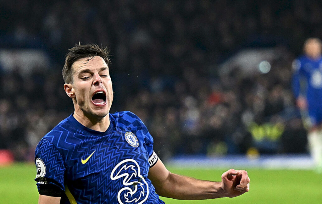 César Azpilicueta in Chelsea blue kit mid-fall dynamic wallpaper Premier League football action