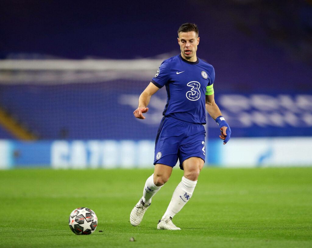 César Azpilicueta Chelsea kit chasing football intense focus dynamic football action wallpaper