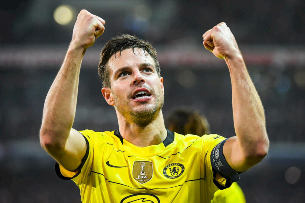 César Azpilicueta celebrating in Chelsea yellow away kit showing passion and leadership on field Wallpaper