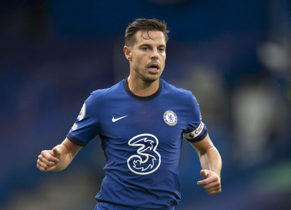 César Azpilicueta sweaty focused in Chelsea blue kit captain armband intense football match wallpaper