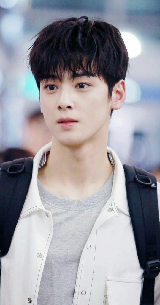 Cha Eun-woo phone wallpaper with calming cool tones and natural youthful expression close-up