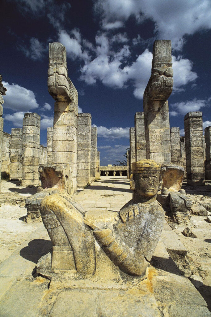 Chac Mool Statue Wallpaper: Chichen Itza Ruins & Blue Sky Background