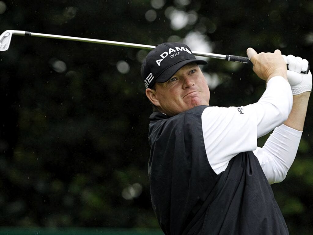 Chad Campbell mid-swing on lush golf course showcasing focused form and competitive golf elegance Wallpaper