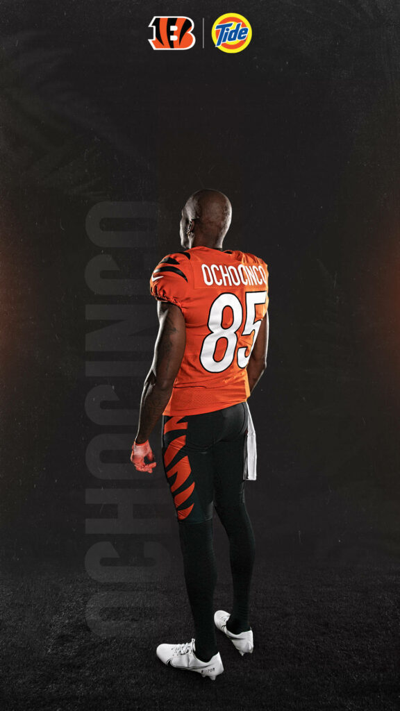 Chad Ochocinco Johnson in Cincinnati Bengals number 85 jersey on dark textured wallpaper background
