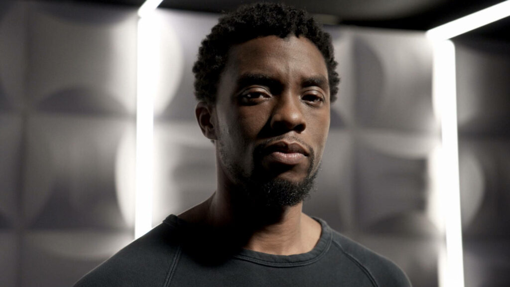 Chadwick Boseman portrait calm expression black shirt geometric soft light minimal design wallpaper