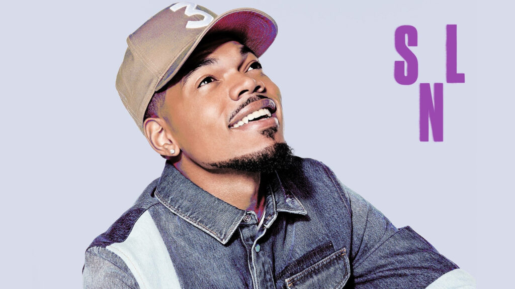 Chance The Rapper smiling in denim jacket and cap on pastel purple SNL wallpaper background