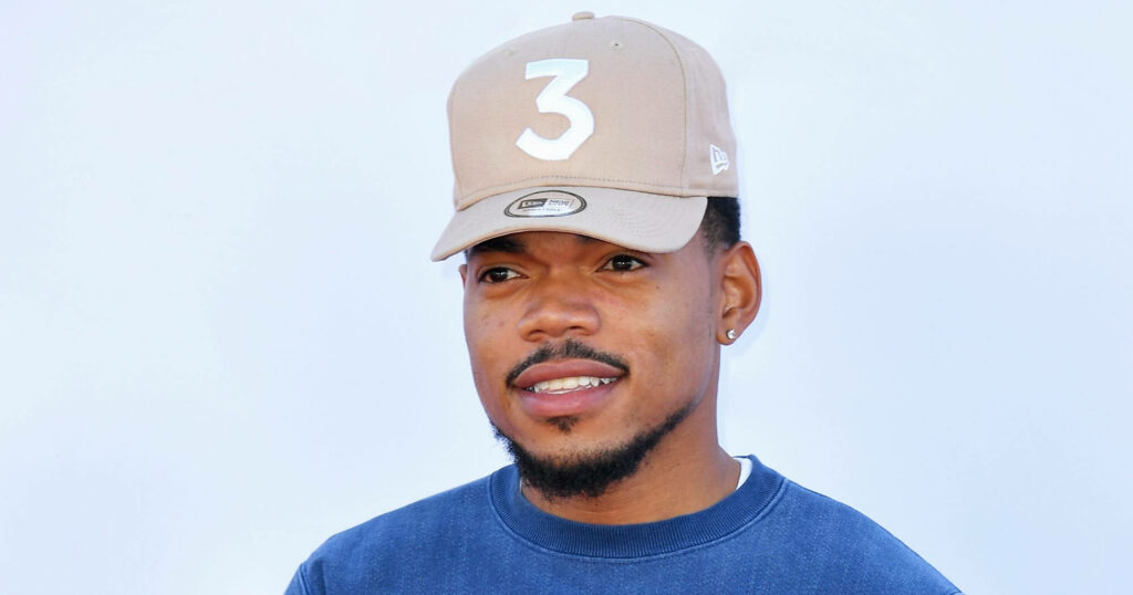 Chance The Rapper wearing tan cap number 3 navy shirt on light background wallpaper image