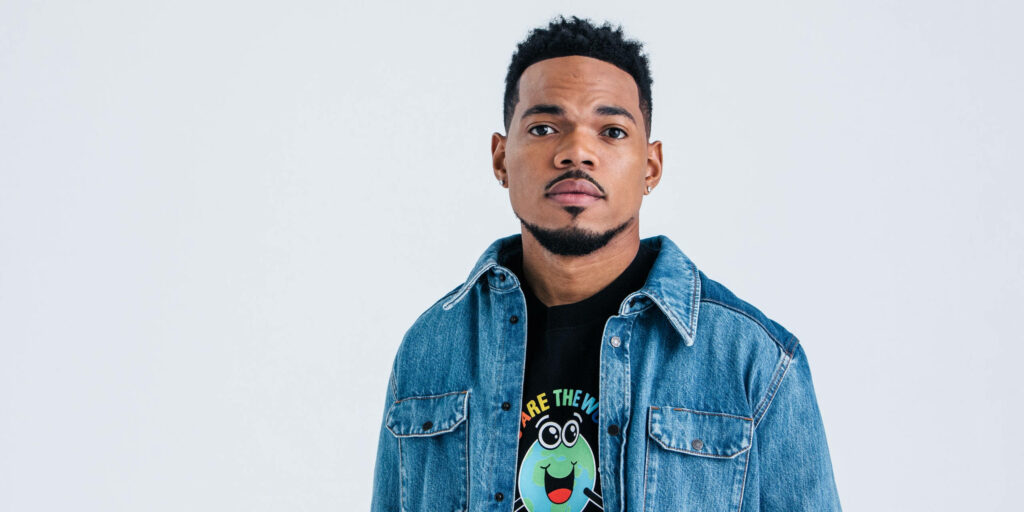 Chance The Rapper in stylish denim jacket and black tee against clean light background wallpaper
