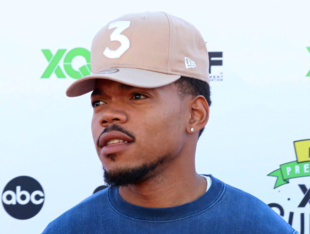 Chance The Rapper in blue sweatshirt and beige cap number 3 vibrant hip hop wallpaper background