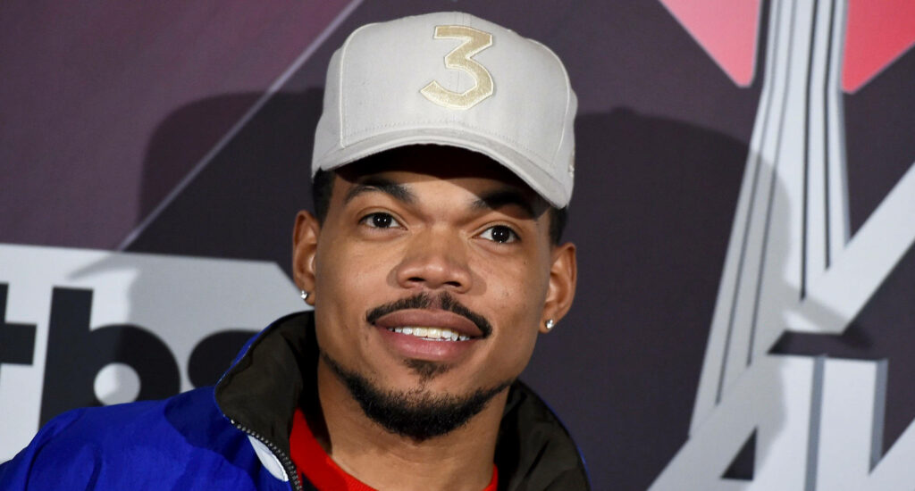 Chance The Rapper smiling wearing signature 3 cap vibrant wallpaper with bold colorful shapes